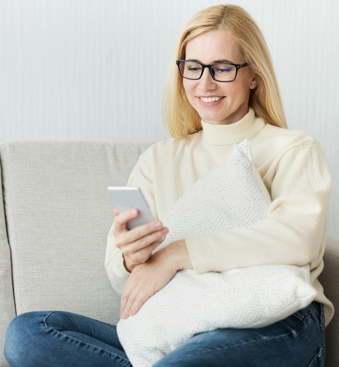 New user. Excited woman using her smartphone